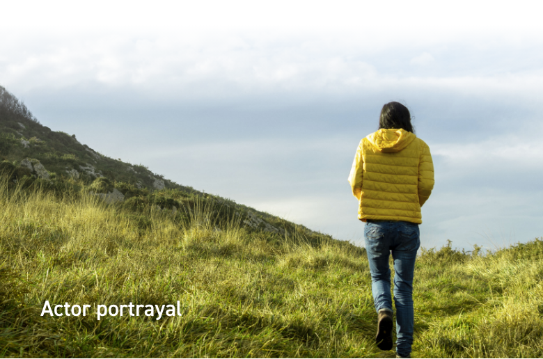 Image of a woman stood on a hill